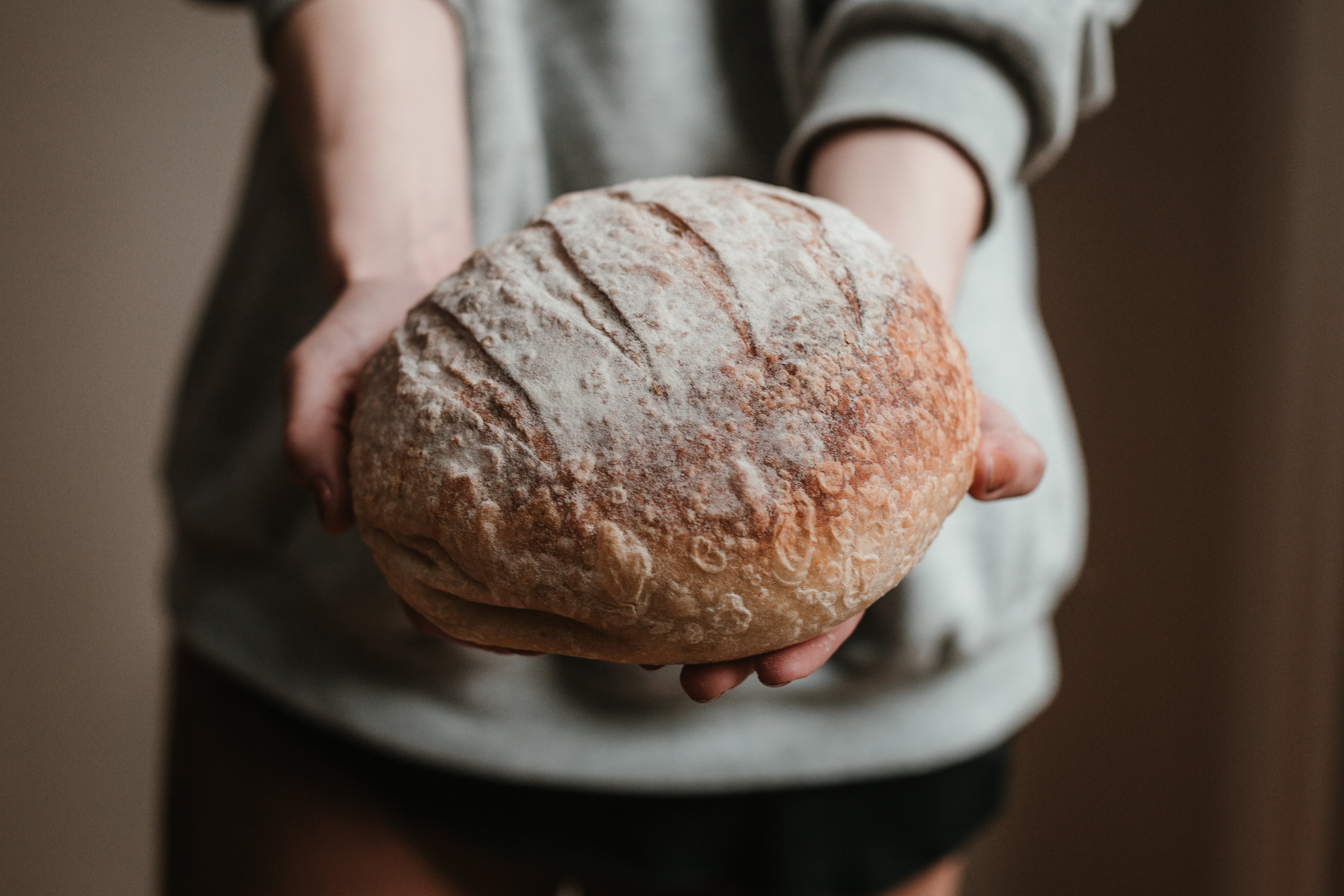 freshly-baked-bread-in-hands.jpg